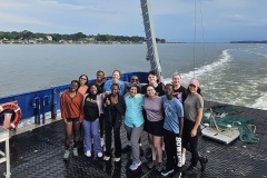 Students gather for a photo on the back of the R/V Savannah.