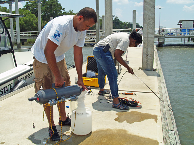 Kevin McKenzie and Tina Walters collect samples during Ocean Sampling Day 2014. 