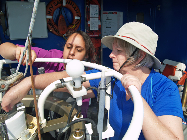 JoCasta Green (right) learns how to prepare a conductivity-temperature-depth sensor array for deployment with the help of Natalia Lopez Figueroa from Hampton University.