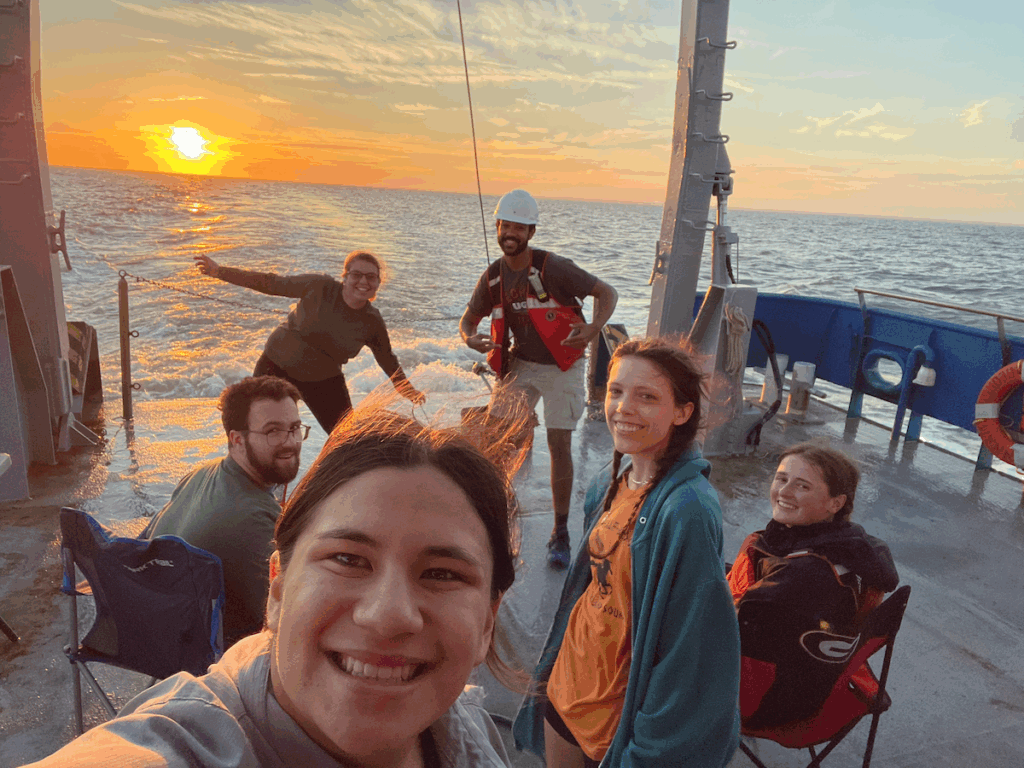 Meier (center) along with her 2022 Semester at Skidaway cohort and SkIO graduate student Ben Lowin (left) on the deck of the R/V Savannah
