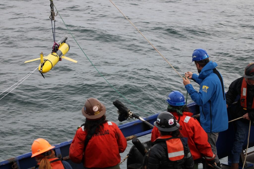 A glider being deployed from a research vessel.