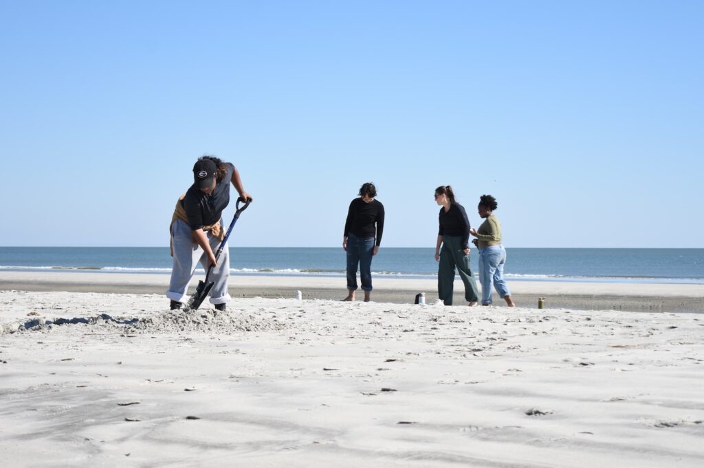 Semester at Skidaway student Macie Phillips digs to reveal the natural mineral layers on Wassaw Island’s Atlantic-facing beach.