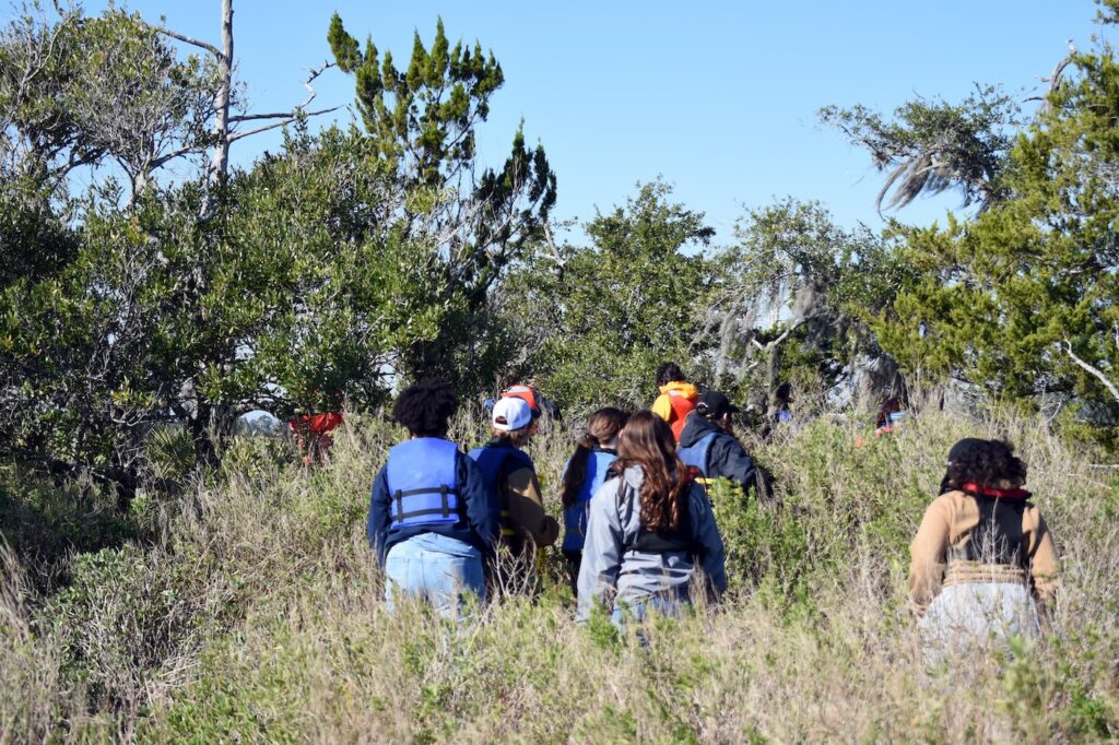 Students hike along a hammock near Wassaw Island. 