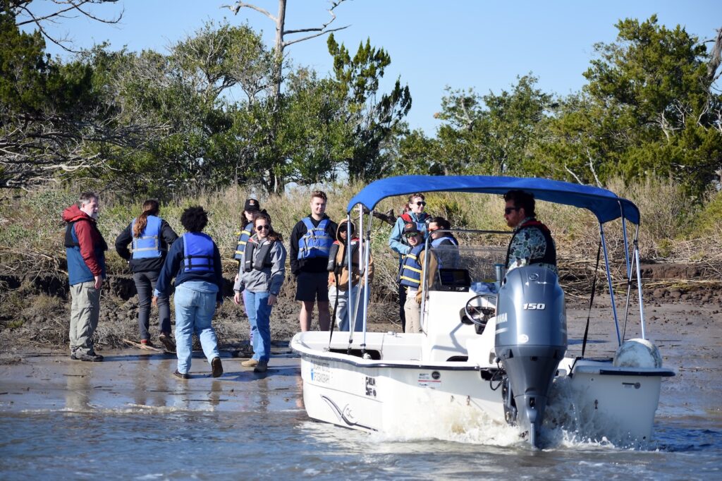 A SkIO skiff pulls up to a hammock near Wassaw Island. 